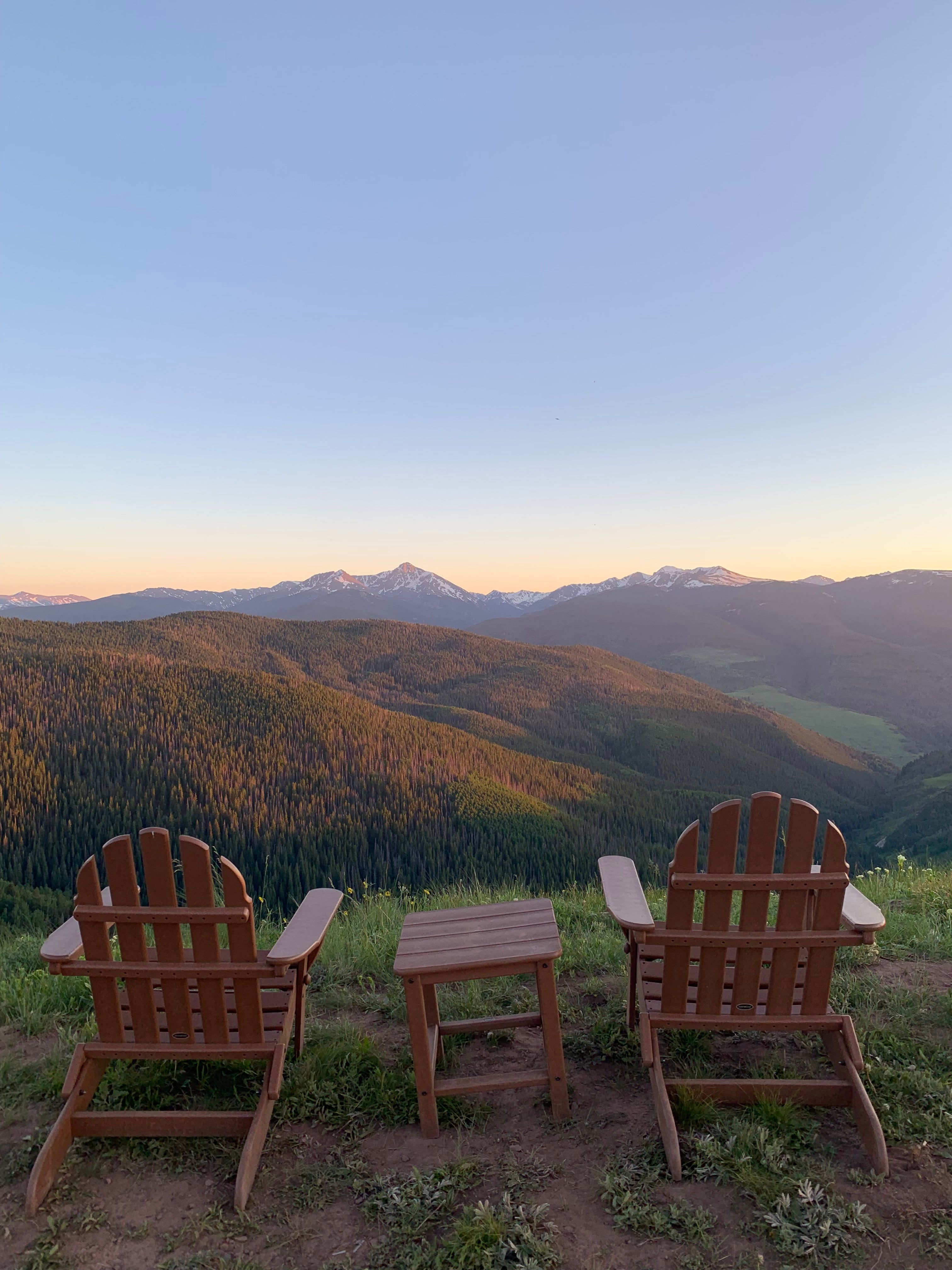 Two chairs looking out over a mountain range