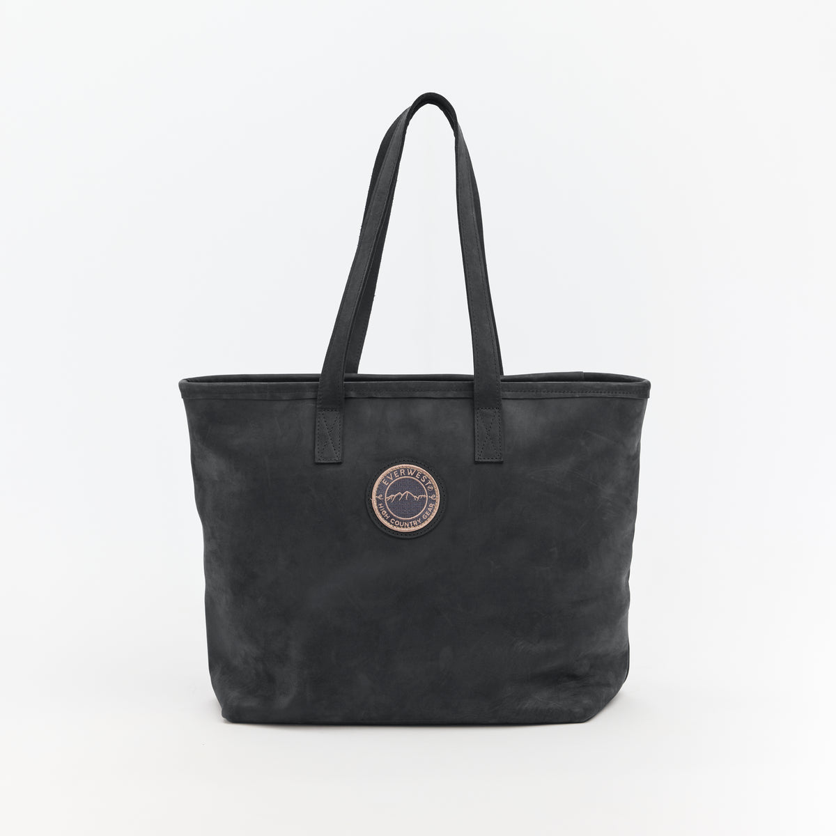 Black leather tote bag with the Everwest logo patch on a white background