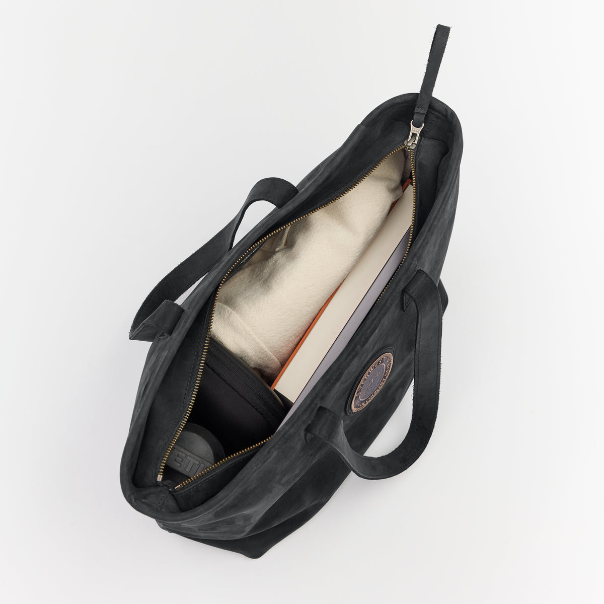 Black leather tote bag with the Everwest brand logo on a white background