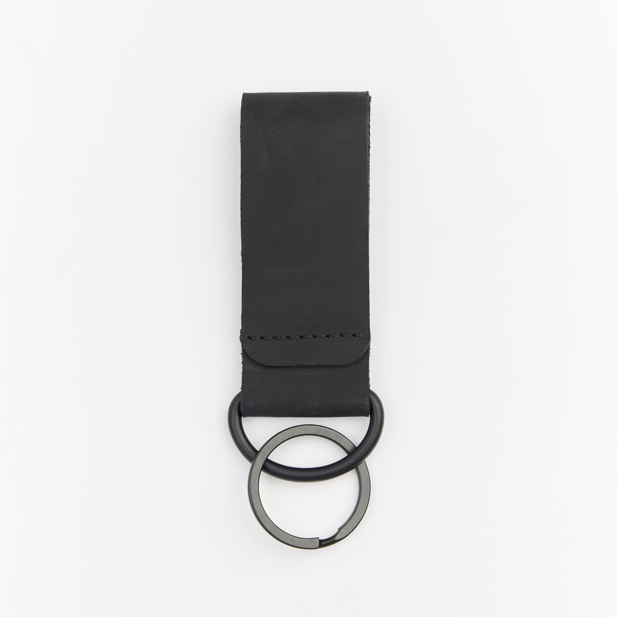 Black leather keychain on a white background