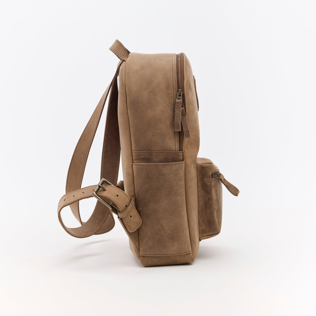 Brown leather backpack on a white background