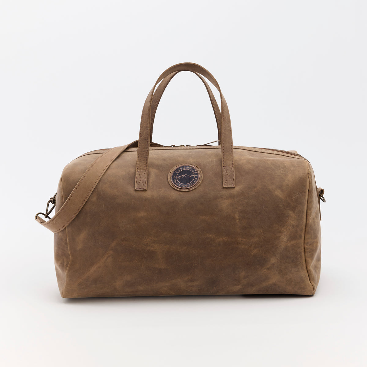 Large brown leather duffel bag with the Everwest brand logo on a white background