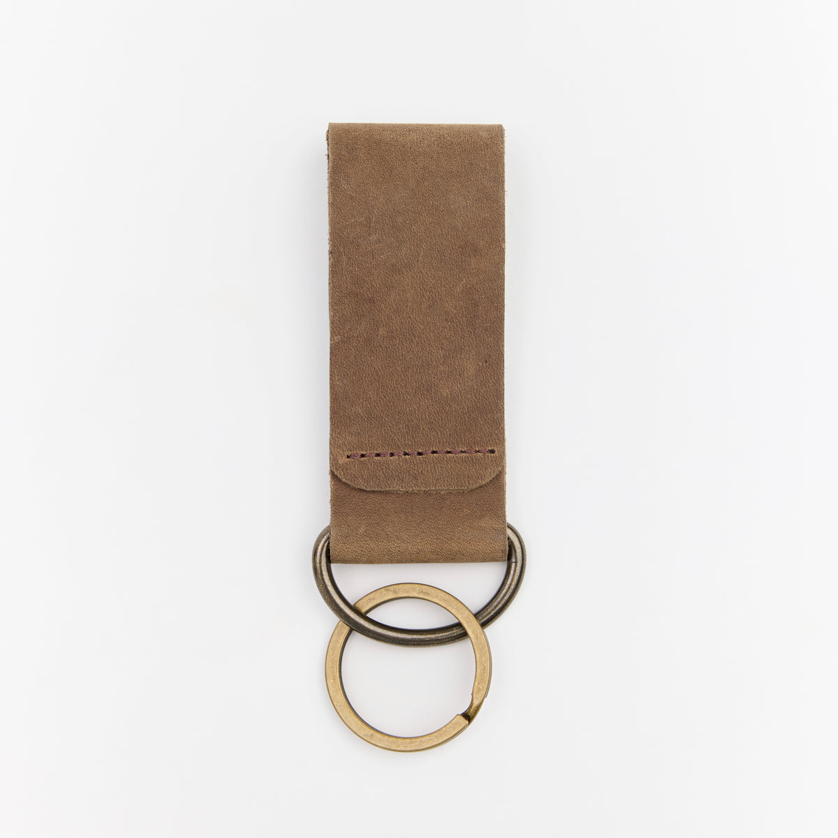 Brown leather key chain with two key rings on a white background
