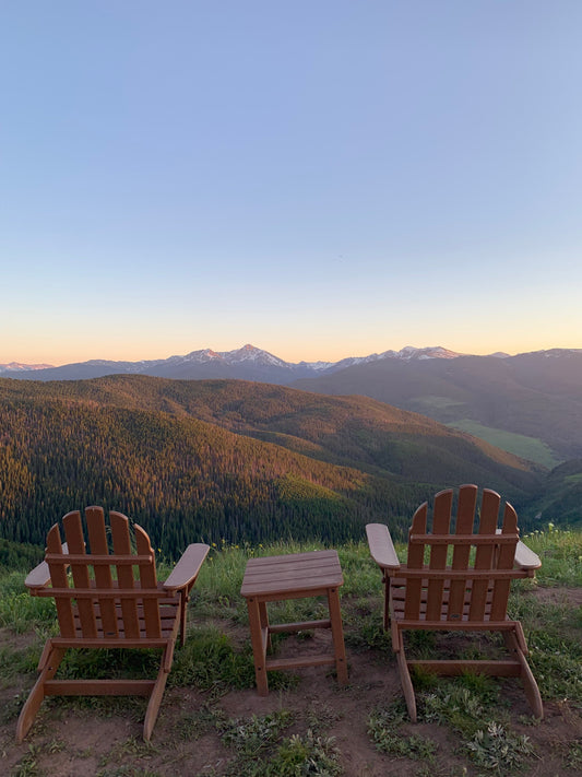 Two chairs looking out over a mountain range 