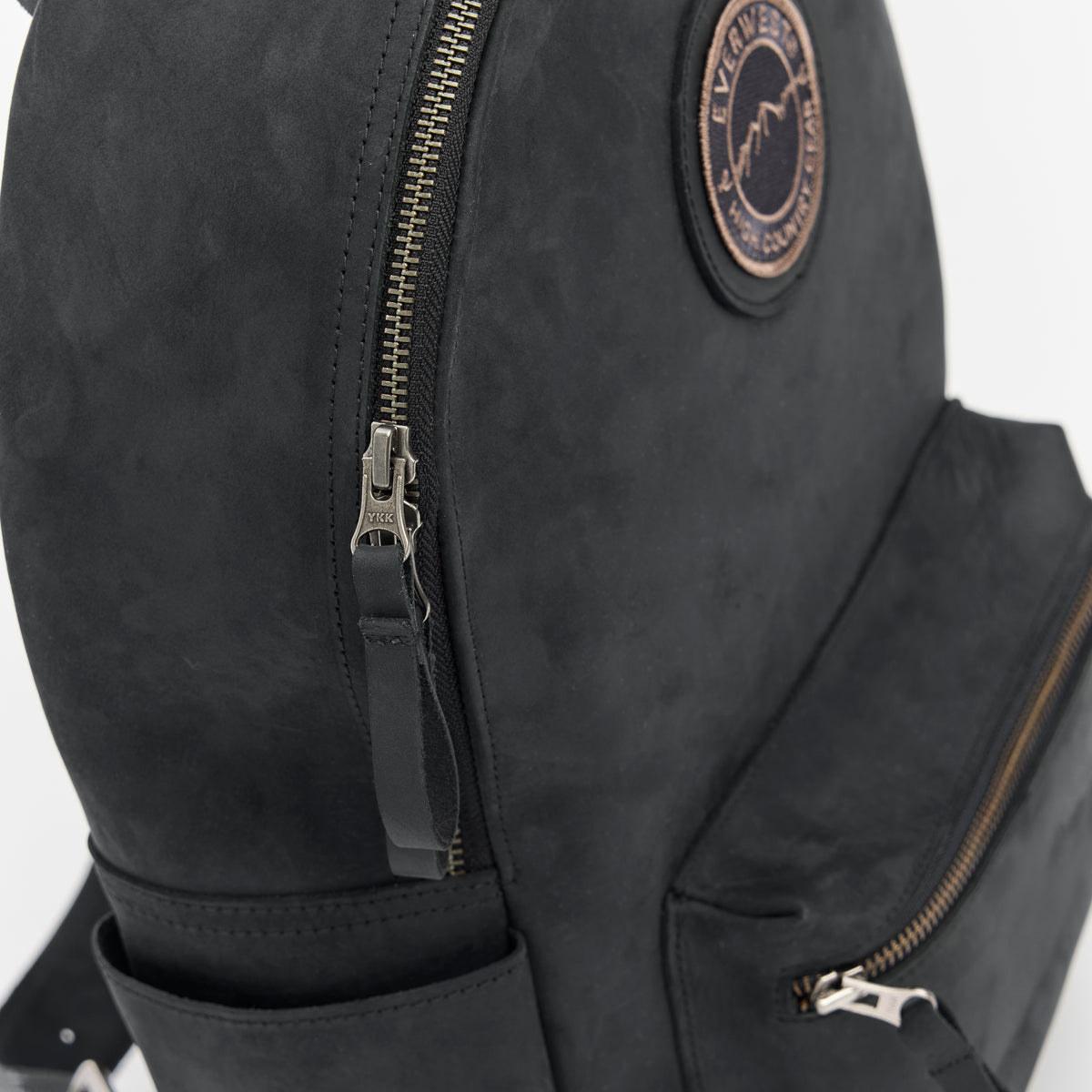 Black backpack with the Everwest brand logo patch on a white background