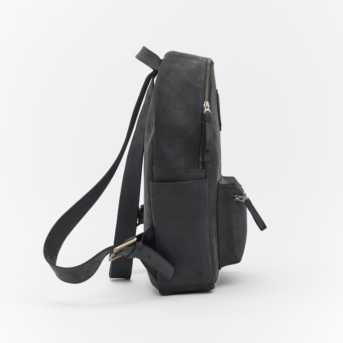 Black leather backpack on a light gray background