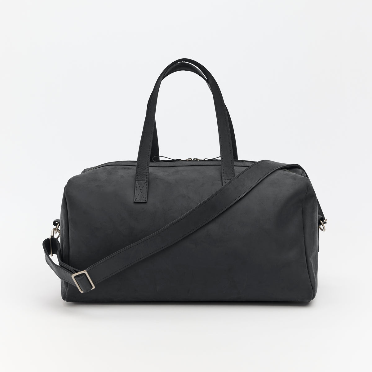 Black leather duffel bag with a shoulder strap on a white background
