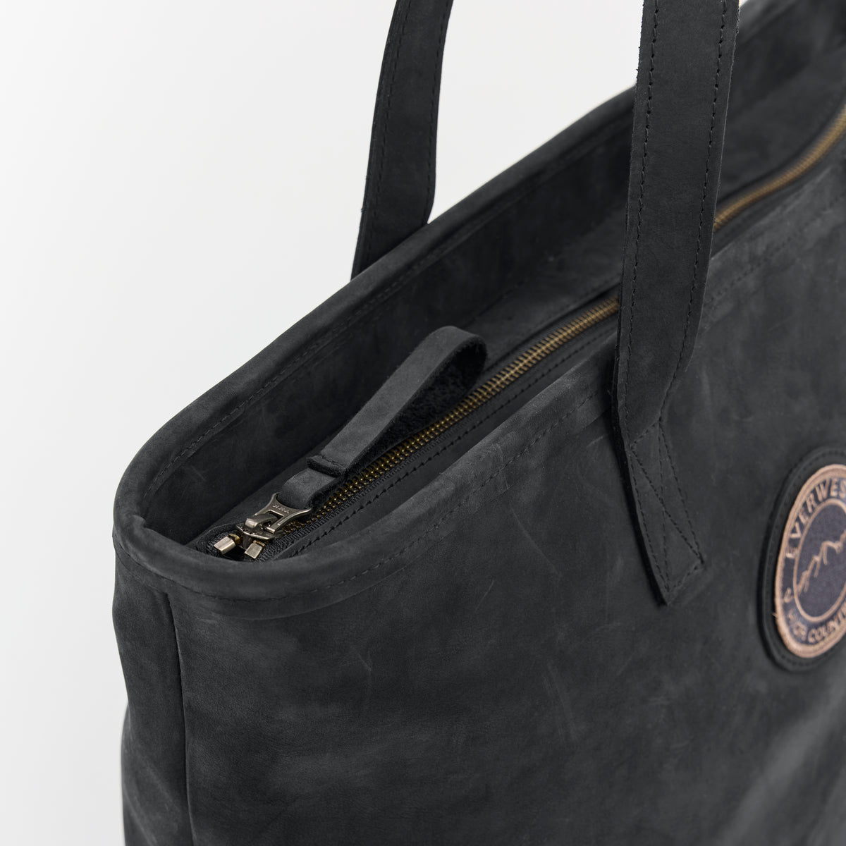 Black leather tote bag with the Everwest brand logo on a white background