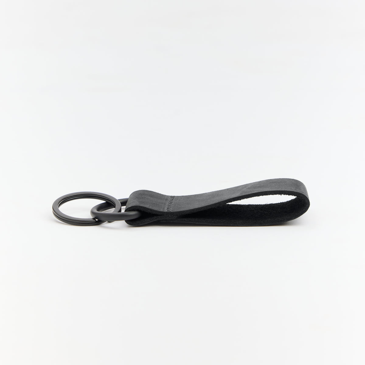 Black leather keychain on a white background