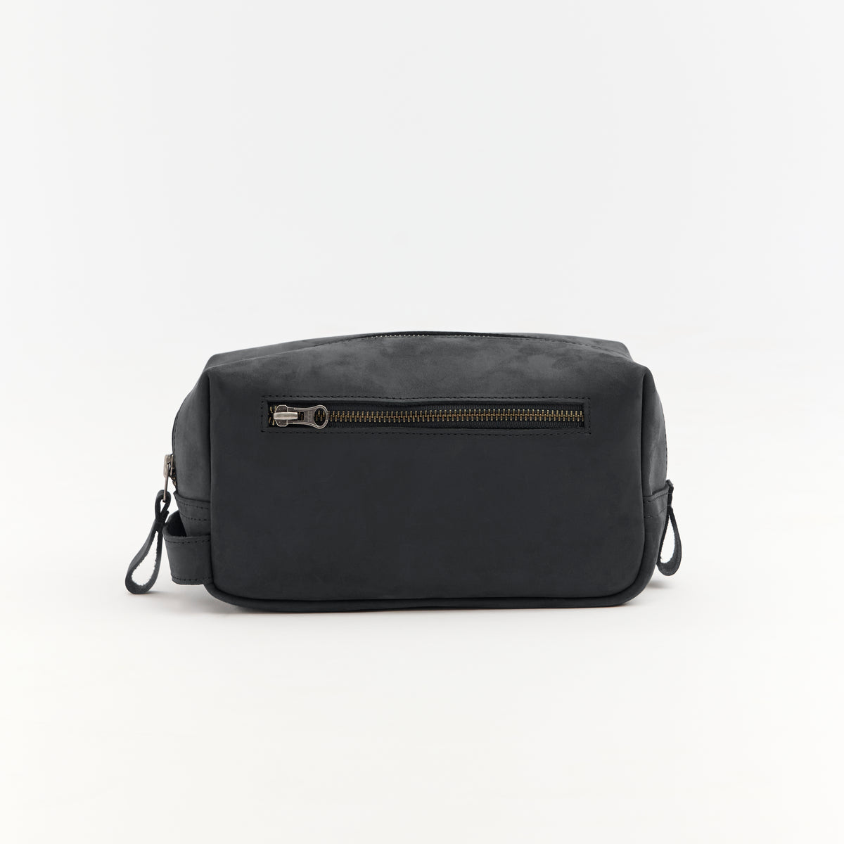 Black leather toiletry bag with zipper on a white background