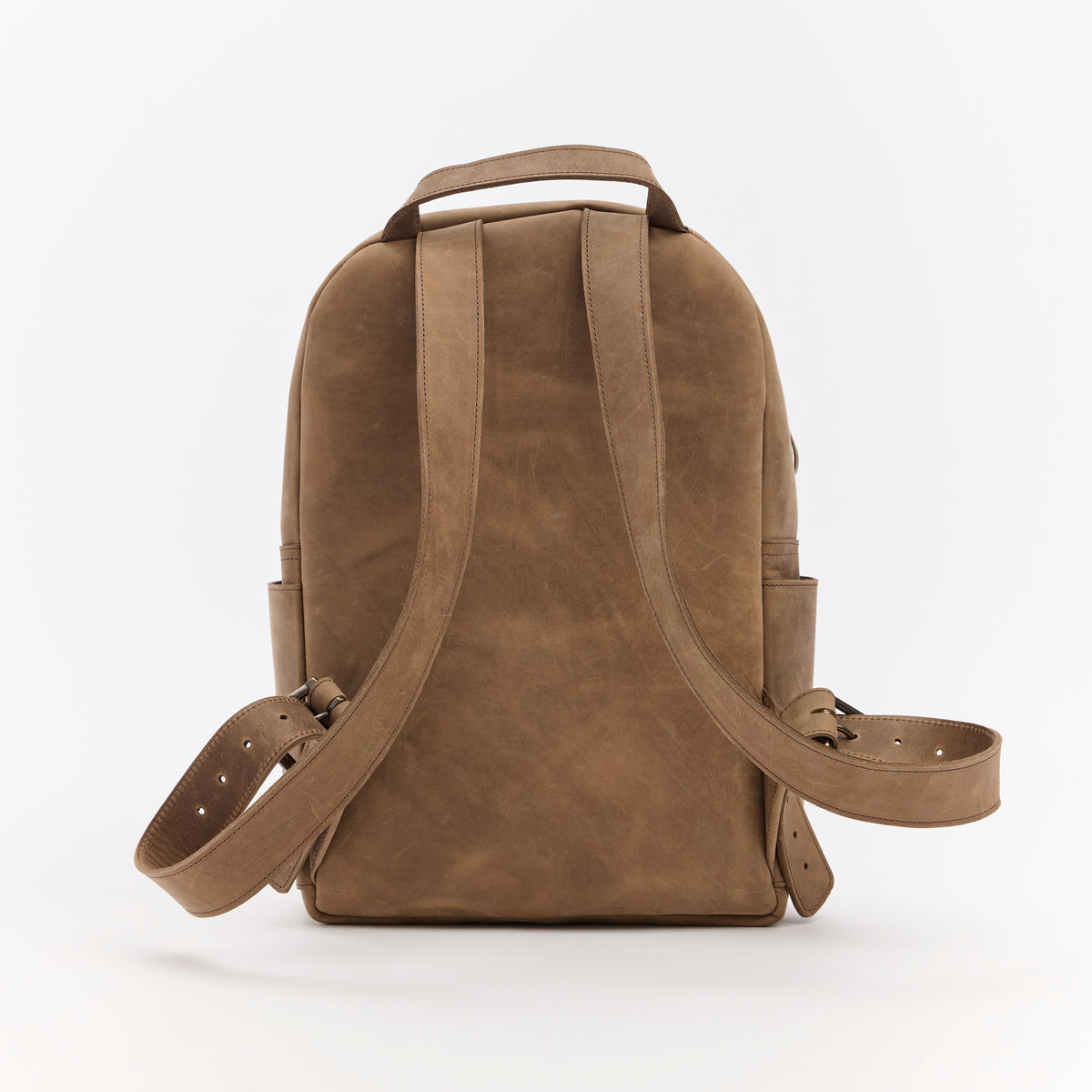 Brown leather backpack on a white background