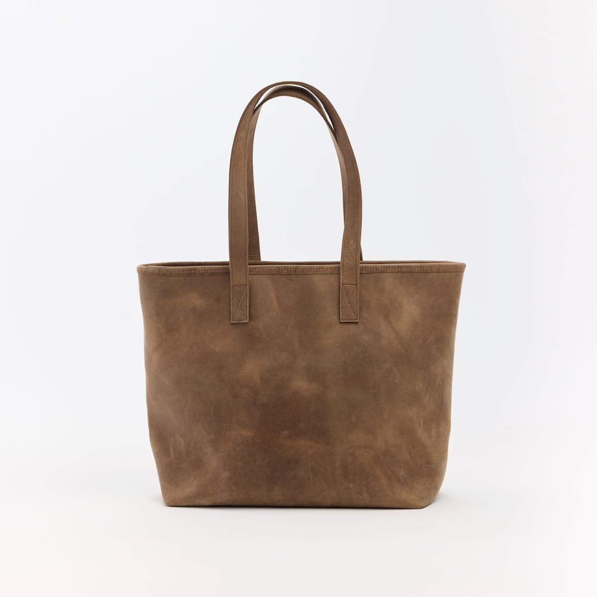 Brown leather tote bag on a white background