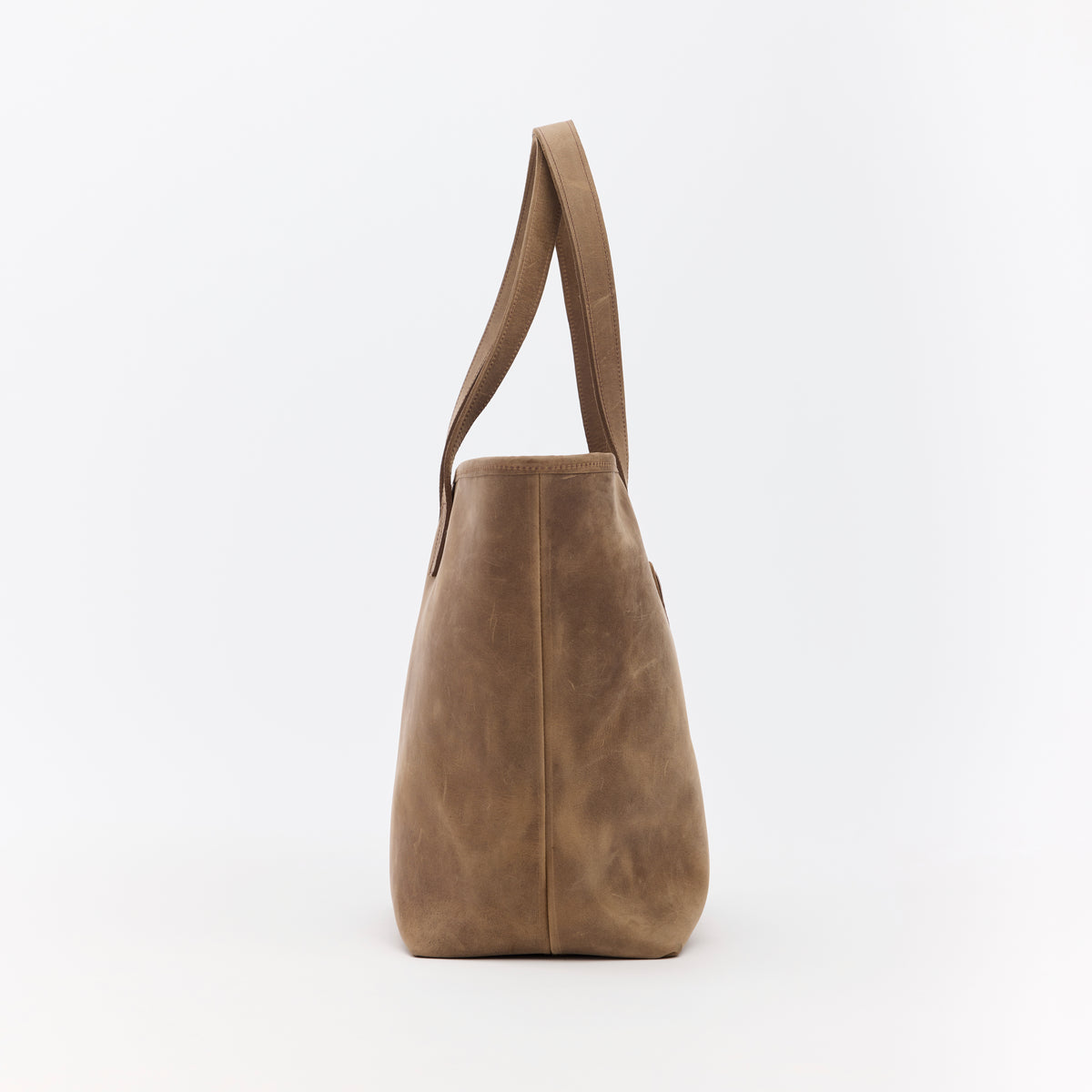 Brown leather tote bag on a white background